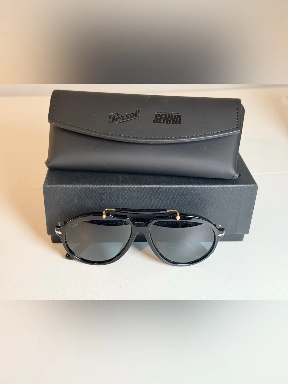 Persol Polarized Sienna Black Sunglasses with Gold Accents and Dark Lenses